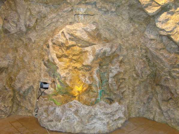 Скалы, гроты, пещеры из декоративного камня для помещений